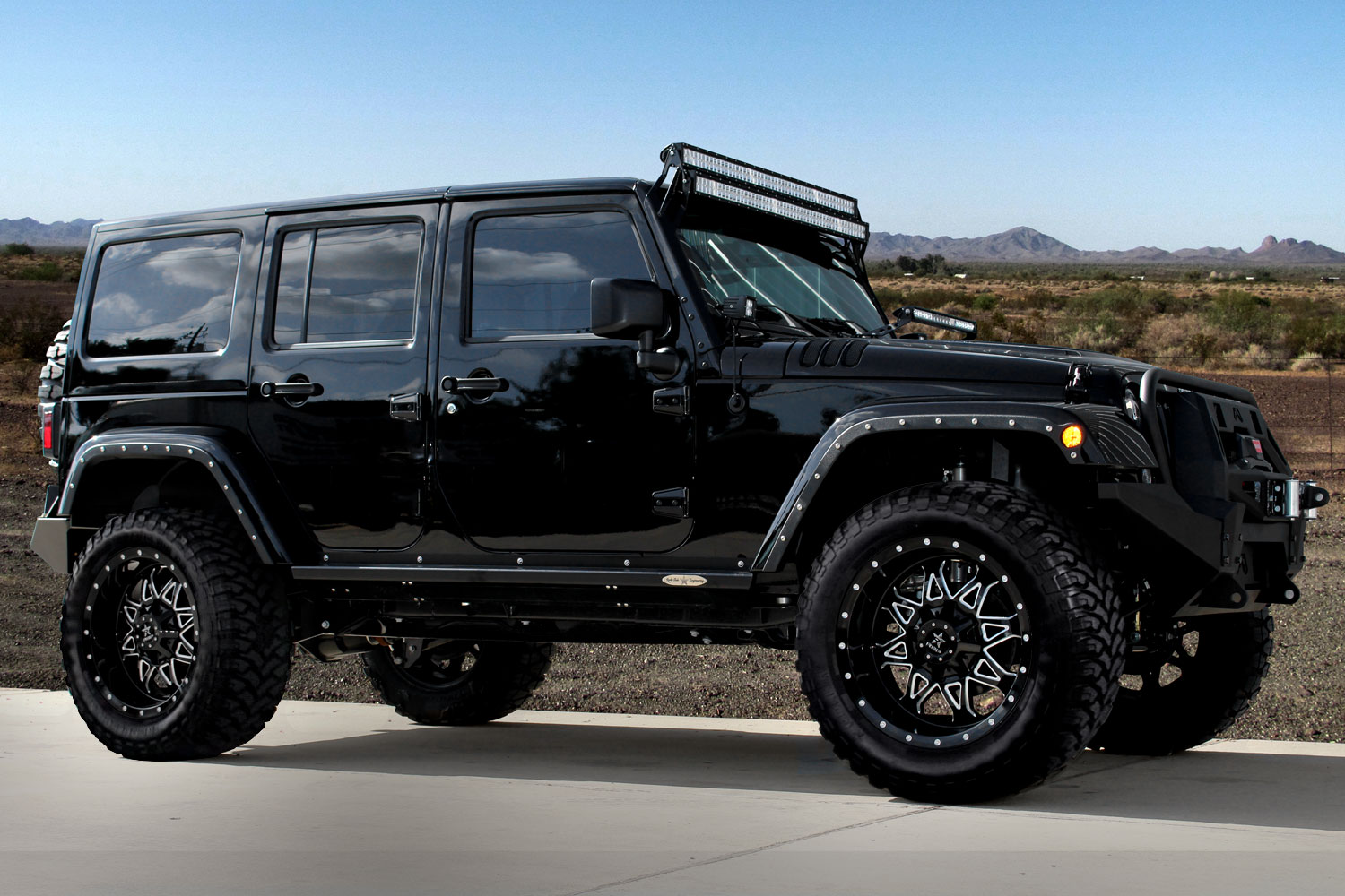An image of a Black Jeep Wrangler on RBP Repulsor M/T tires