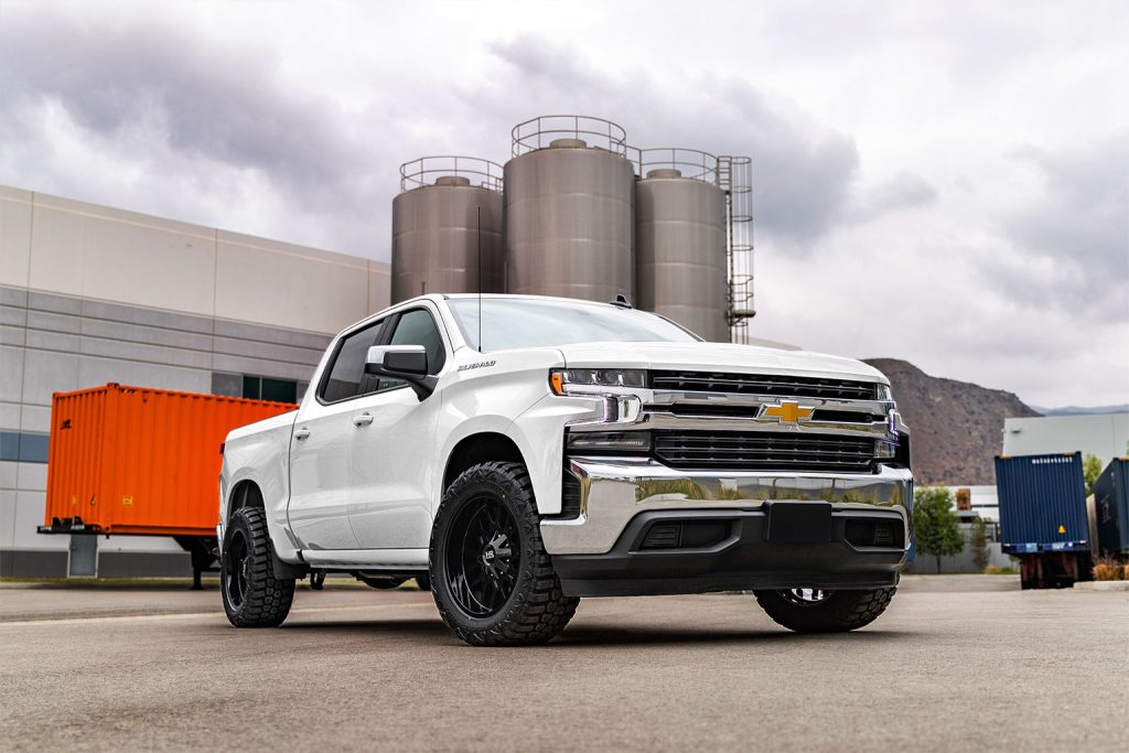 Image of a white Chevy Silverado with RBP tires on an overcast day