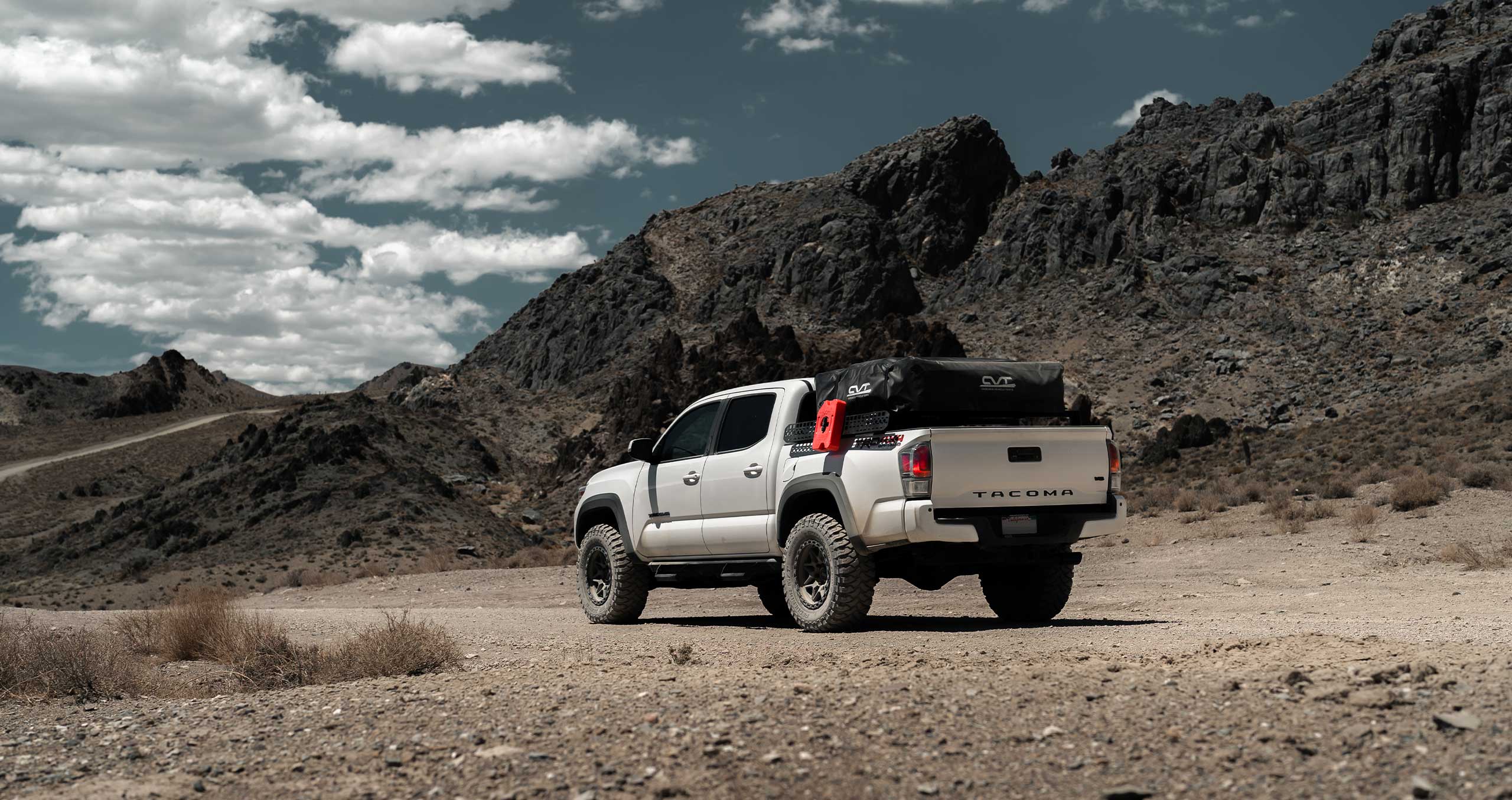 An image of a Toyota Tacoma in a desert on RBP Repulsor M/T tires