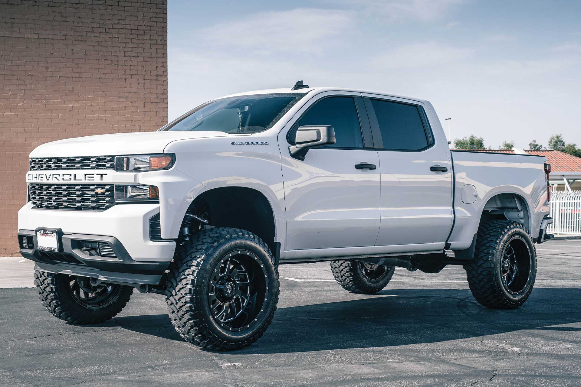 An image of a white Chevy Silverado on RBP Repulsor M/T tires