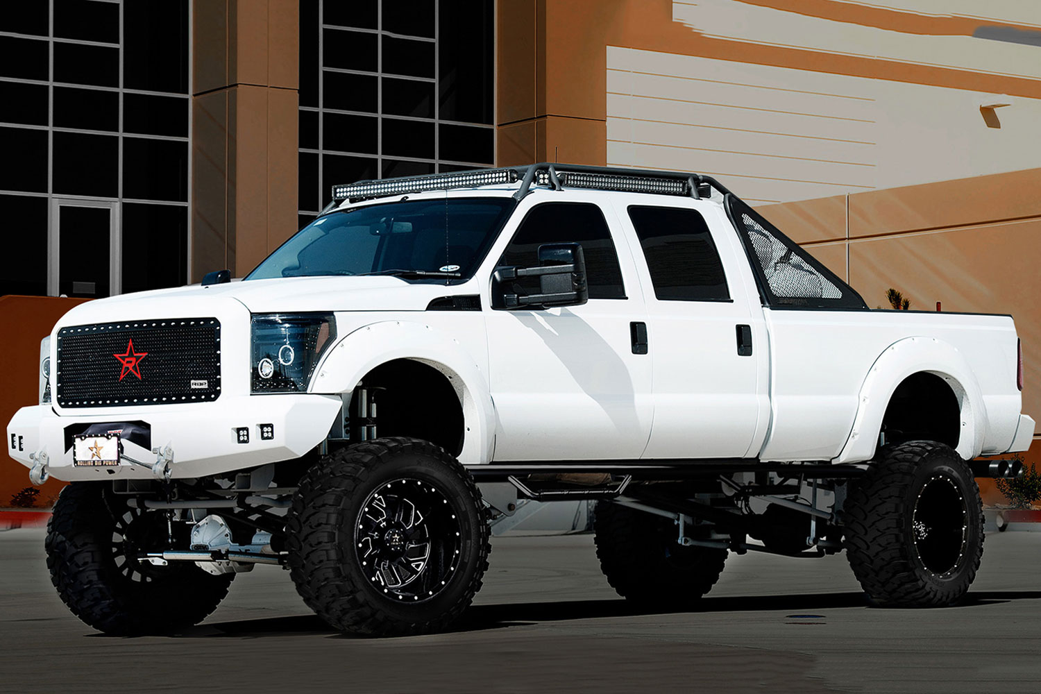 An image of a white Ford F350 on RBP Repulsor M/T tires