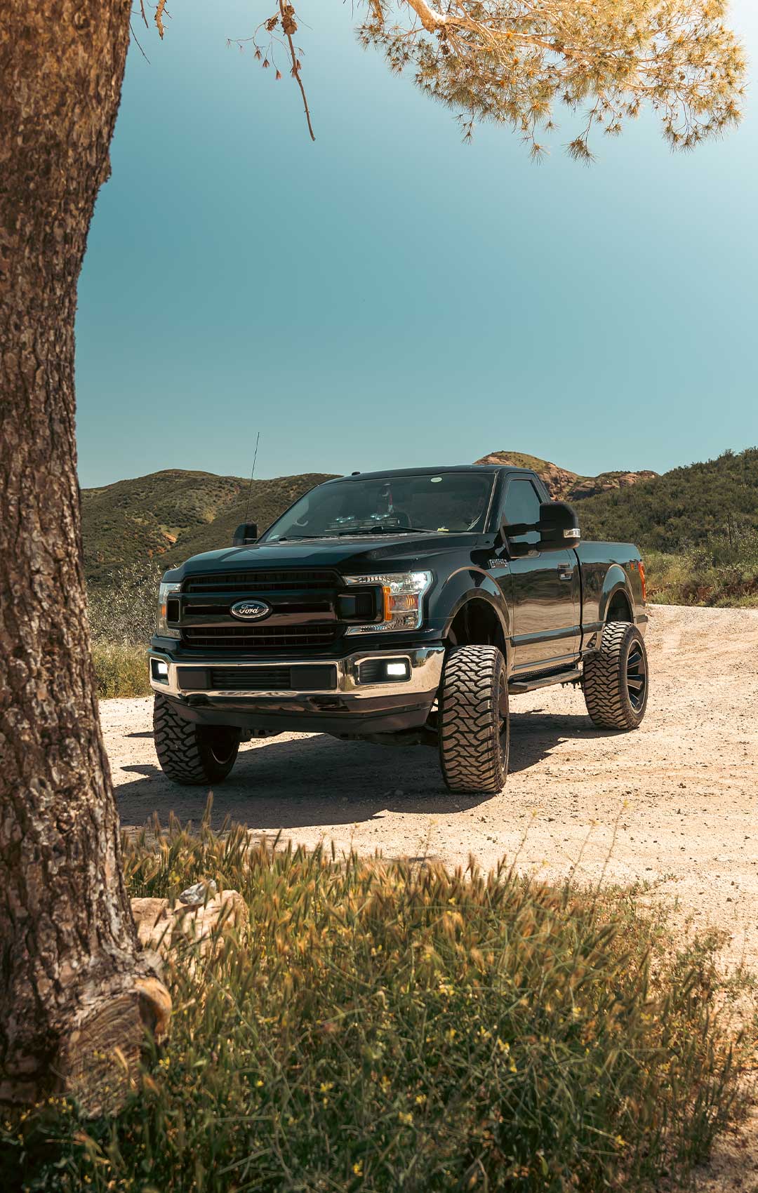 black ford f150 truck with rbp mt3 tires