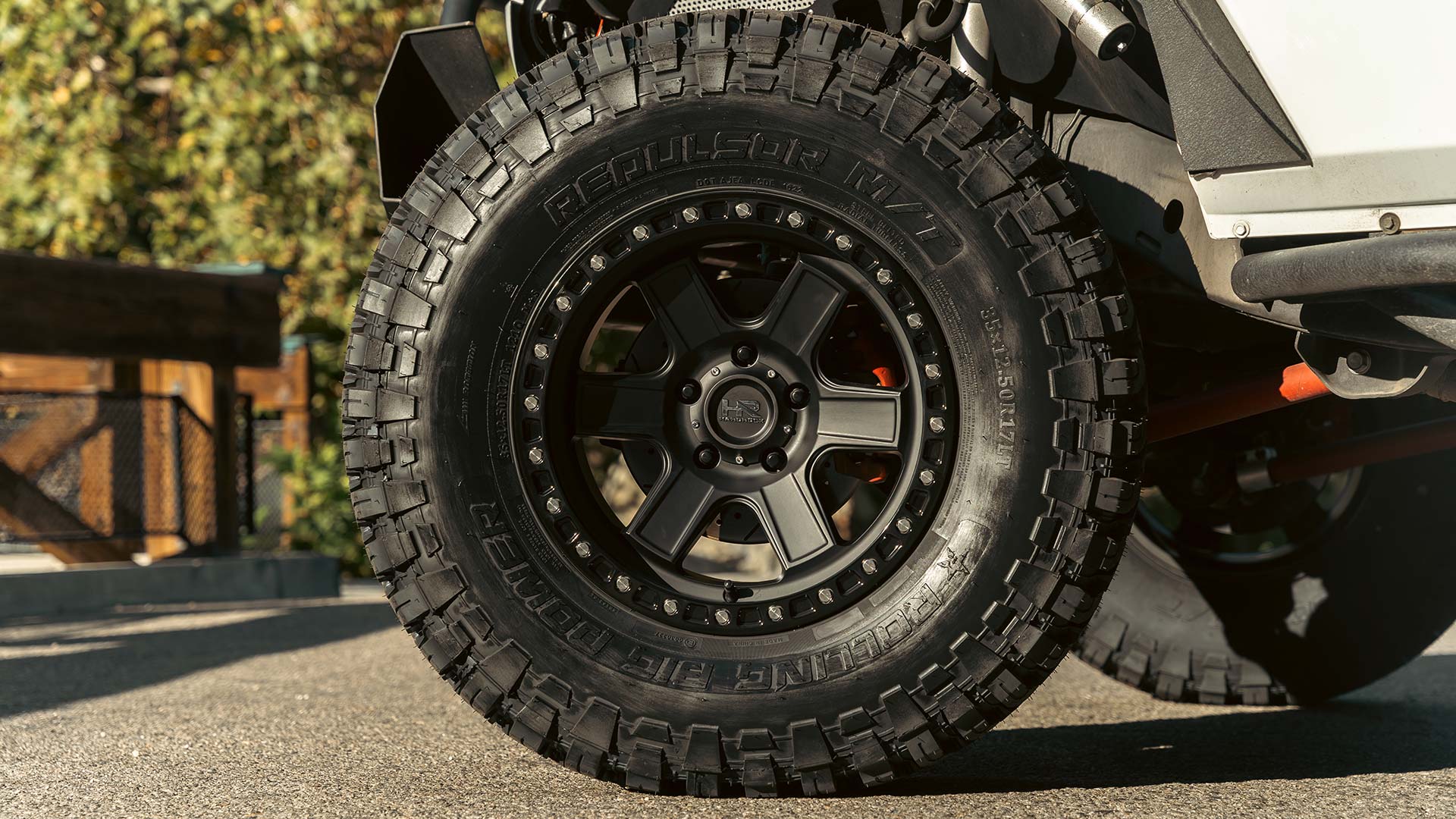 white jeep wrangler with black off road wheels and rbp tires