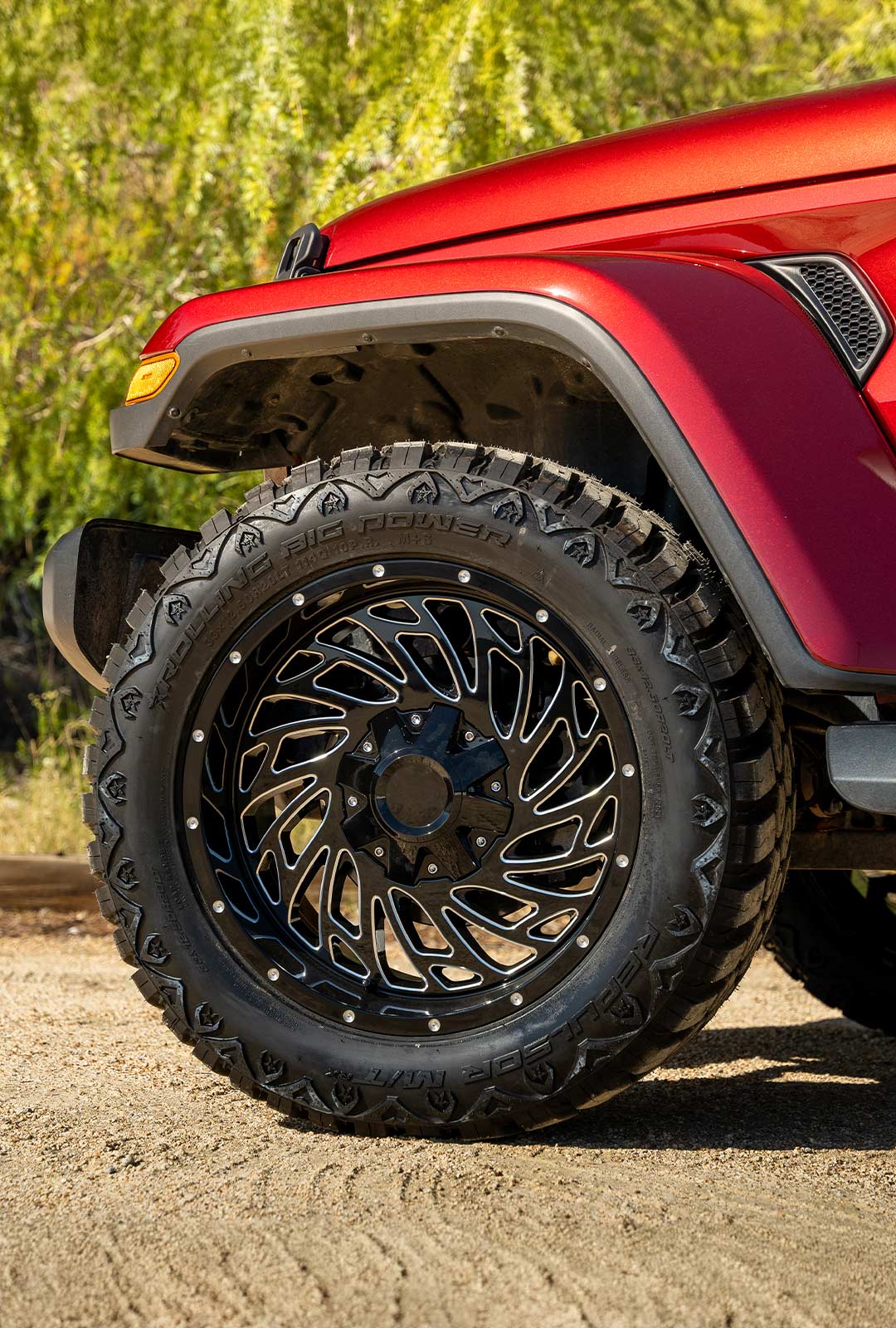 red jeep wrangler with black machined wheels